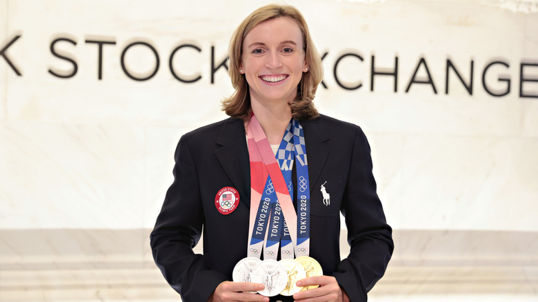 Katie Ledecky holding olympic medals