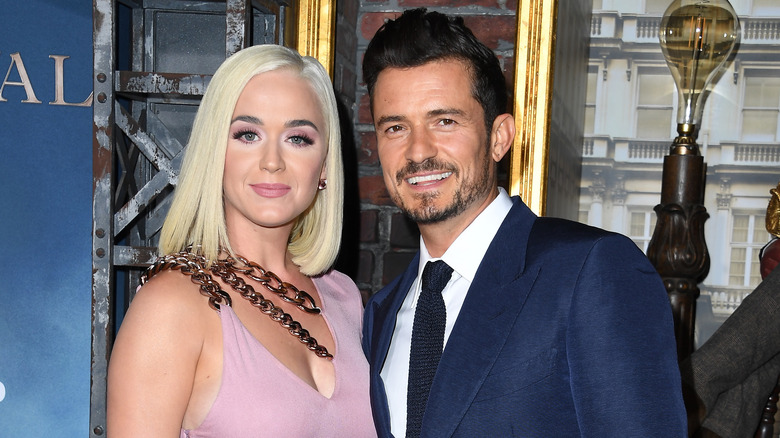 Katy Perry with blond hair, Orlando Bloom with facial hair