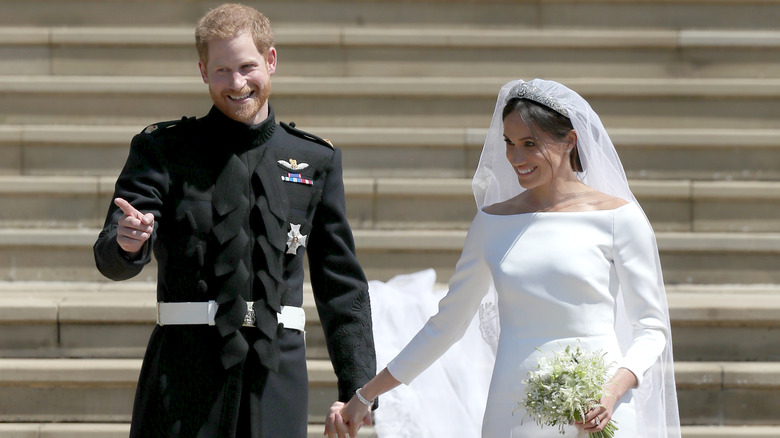 Prince Harry and Meghan Markle holding hands