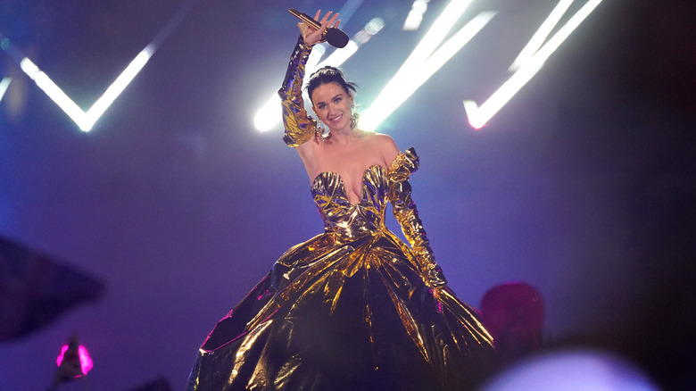 Katy Perry waving with microphone