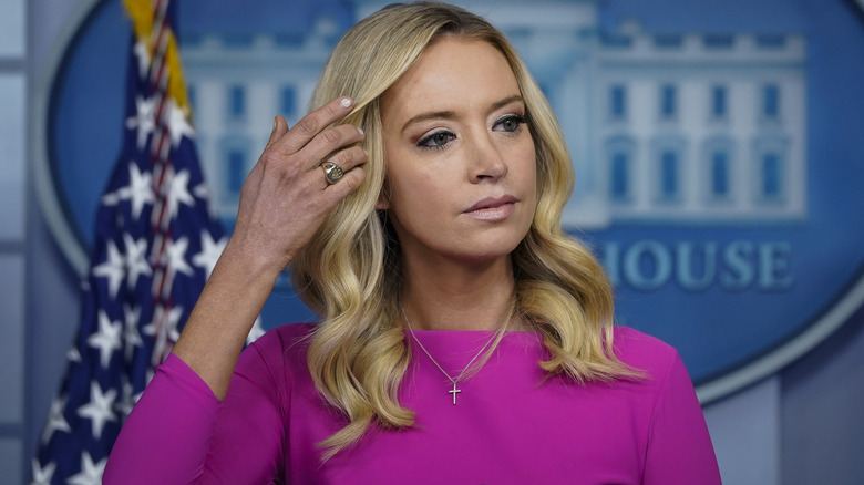 Kayleigh McEnany brushing hair aside