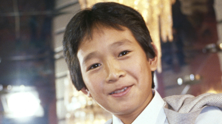 Ke Huy Quan smiles at age 12