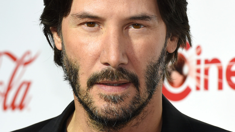 Keanu Reeves with his mouth slightly open