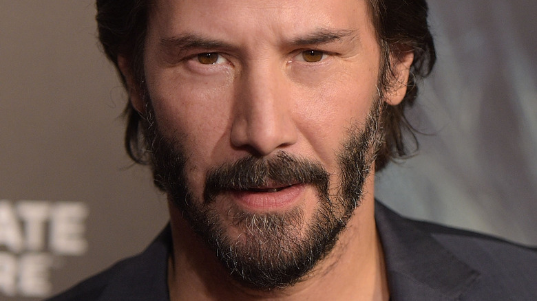 Keanu Reeves deeply staring at the camera