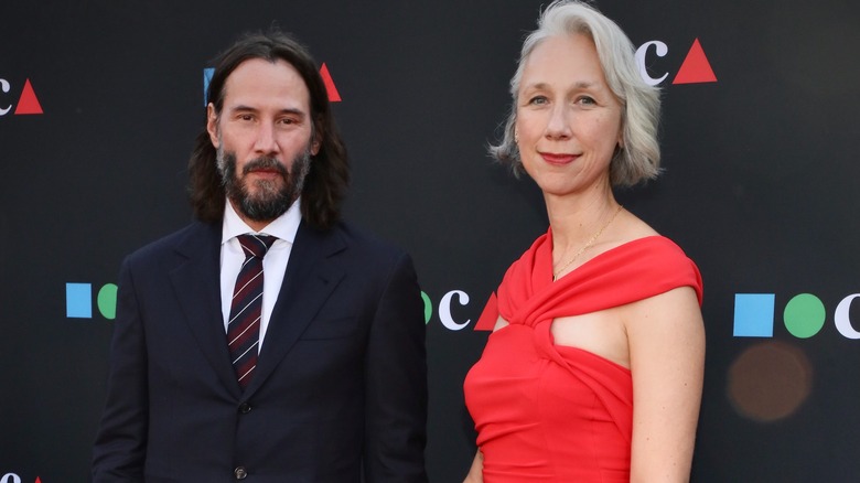 Keanu Reeves posing with girlfriend Alexandra Grant