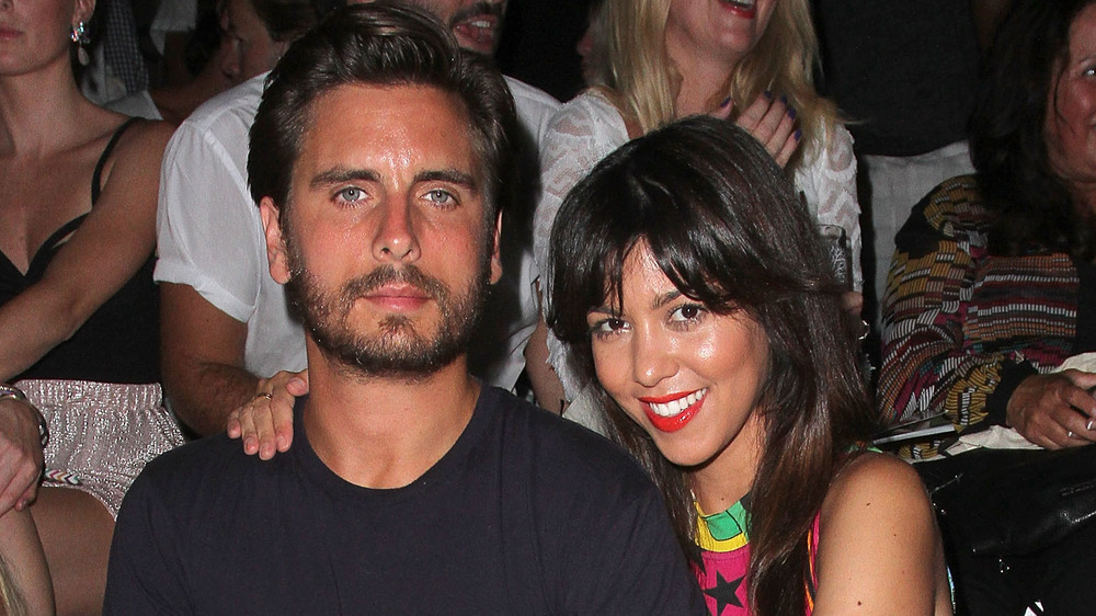 Scott Disick and Kourtney Kardashian pose for a photo