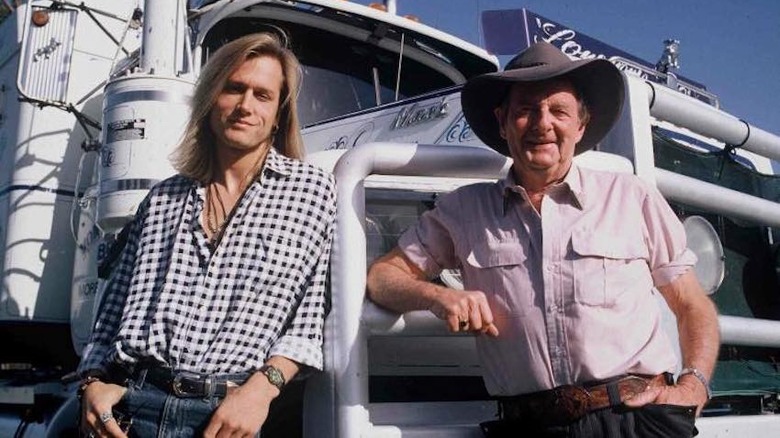 Keith Urban and Slim Dusty posing on a truck