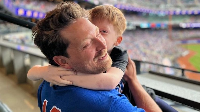 Beau Richards hugging child