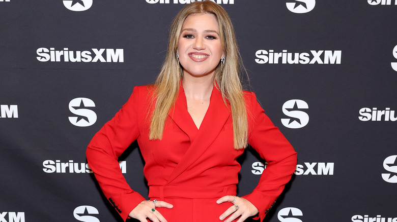 Kelly Clarkson wearing a red jumpsuit