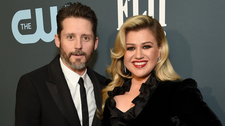 Brandon Blackstock and Kelly Clarkson posing for a photo 