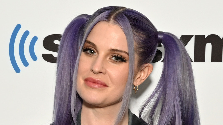 Kelly Osbourne posing