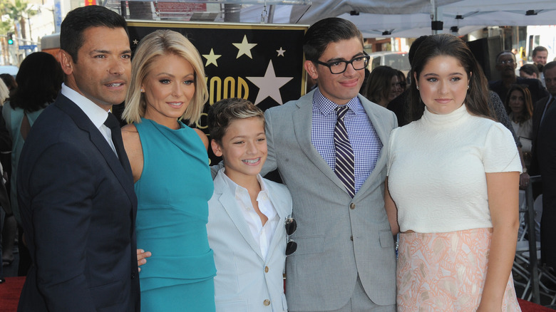 The Consuelos family posing