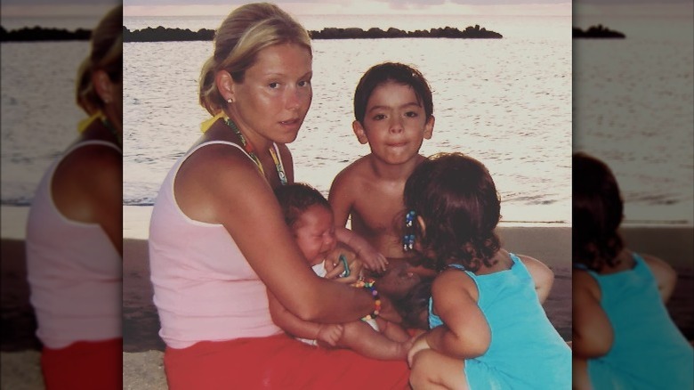 Kelly Ripa seated with kids