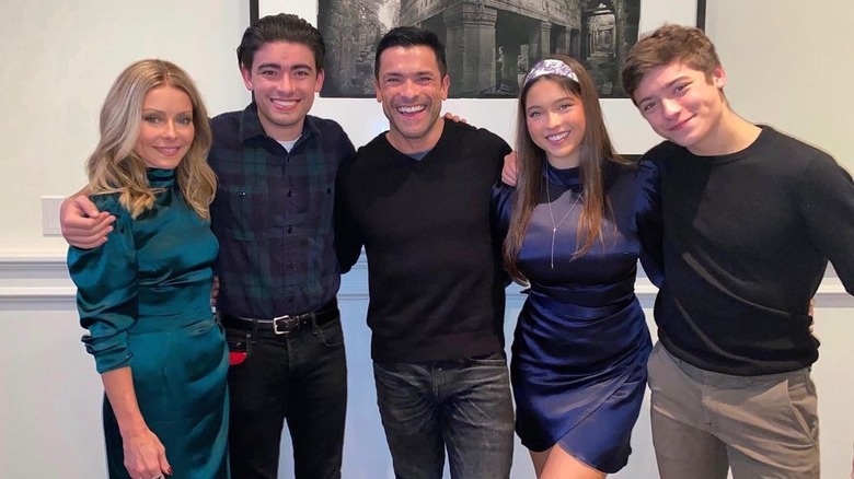 The Consuelos family posing