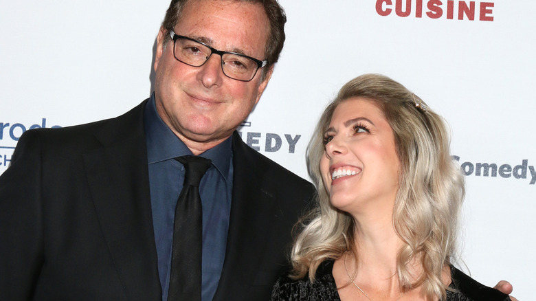 Kelly Rizzo smiles up at husband Bob Saget 2019