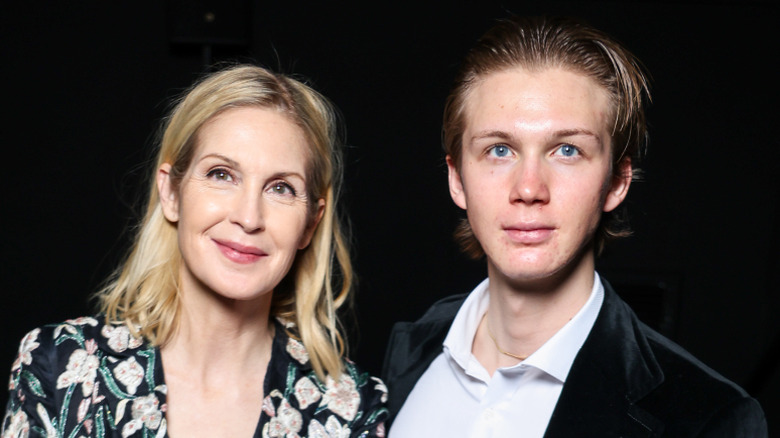 Kelly Rutherford seated alongside Hermes Gustaf Daniel Giersch at a Patou fashion show.