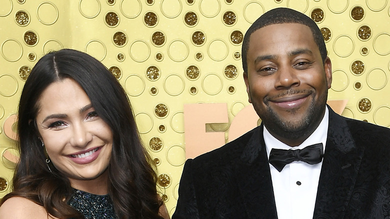 Kenan Thompson and Christina Evangeline smiling for cameras at an event 