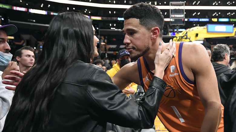 Kendall Jenner and Devin Booker talking