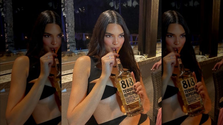 Kendall Jenner drinking 818 tequila with straw