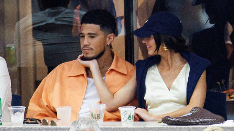 Kendall Jenner and Devin Booker sitting
