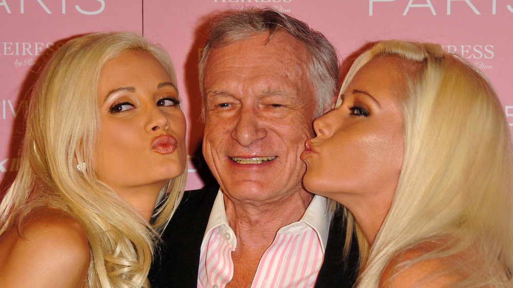 Holly Madison, Hugh Hefner, and Kendra Wilkinson  kiss