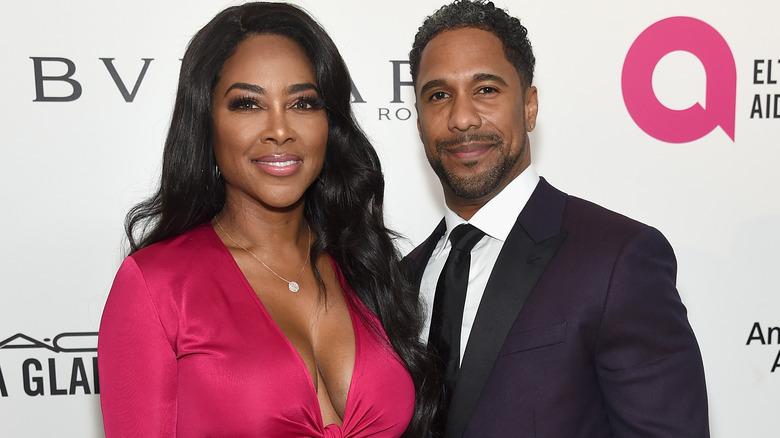 Kenya Moore and Marc Daly attend the 26th annual Elton John AIDS Foundation's Academy Awards Viewing Party 