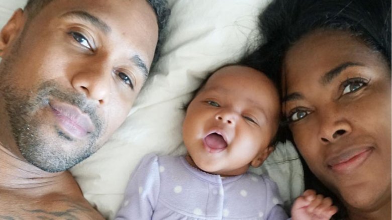 Marc Daly, Kenya Moore and daughter Brooklyn in bed