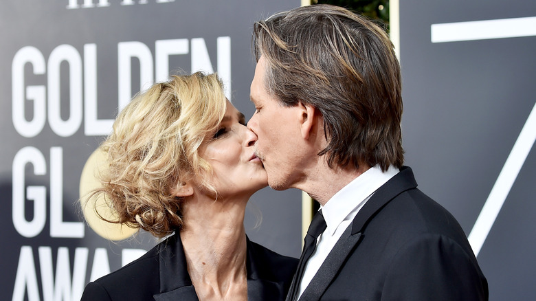 Kyra Sedgwick and Kevin Bacon kissing