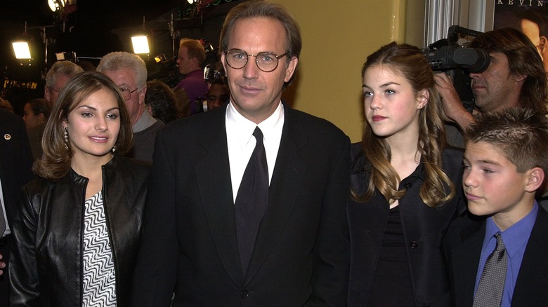 Kevin Costner posing with his children