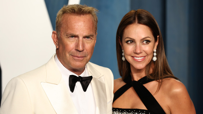 Kevin Costner and Christine Baumgartner smiling