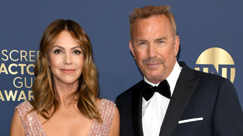 Kevin Costner and Christine Baumgartner posing