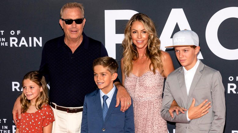 Kevin Costner and Christine Baumgartner attend an event with their kids, Grace, Hayes and Cayden