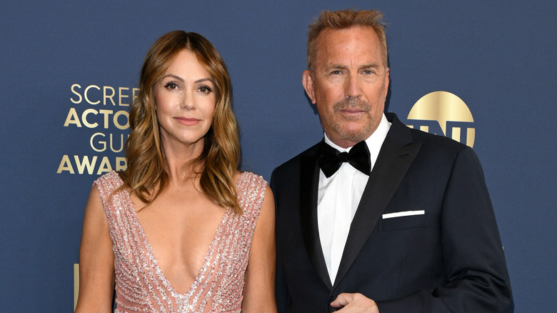 Kevin Costner and Christine Baumgartner posing