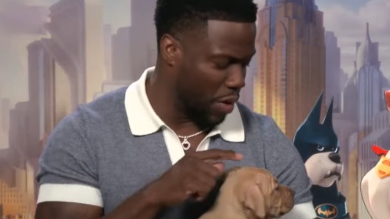 Kevin Hart holds a puppy