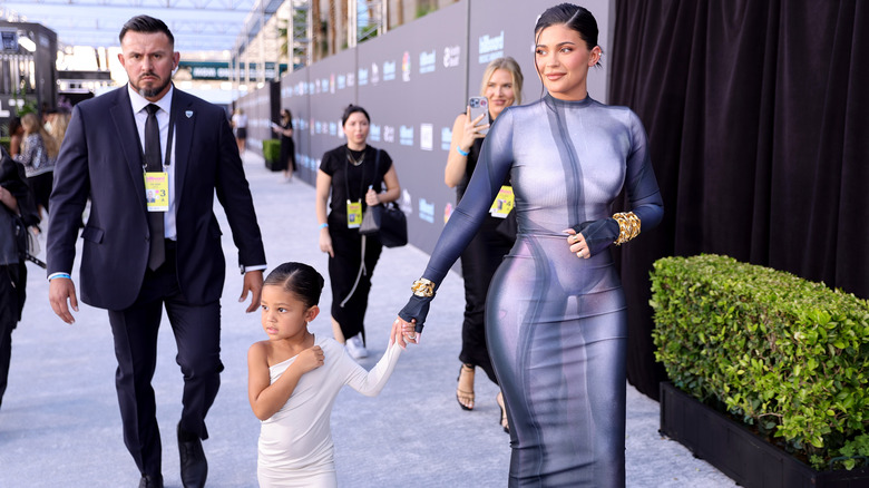 Travis Scott, Kylie Jenner, Stormi posing