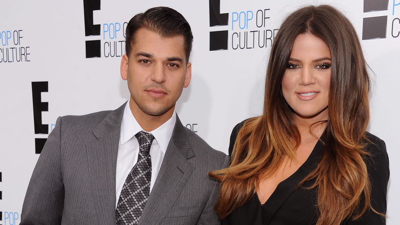 Khloé Kardashian and Rob Kardashian smiling