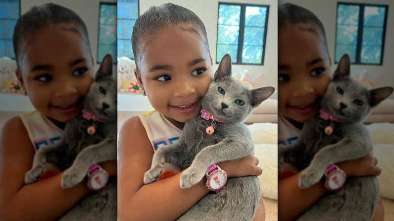 True Thompson holding her kitten