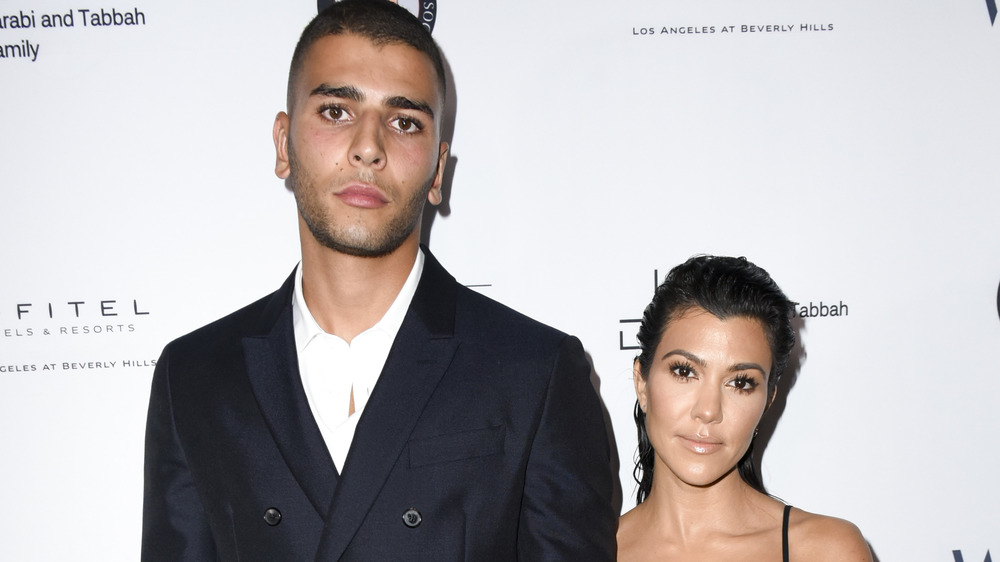 Younes Bendjima and Kourtney Kardashian posing