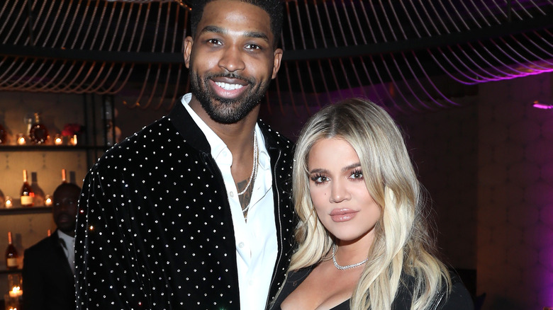 Tristan Thompson smiling Khloe Kardashian long blonde hair