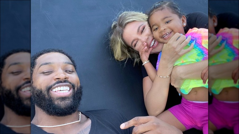 Tristan Thompson, Khloé Kardashian, and True Thompson smiling