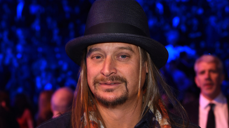 Kid Rock poses in signature fedora