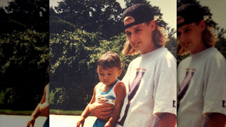 Kid Rock holds young Robert James Ritchie Jr.