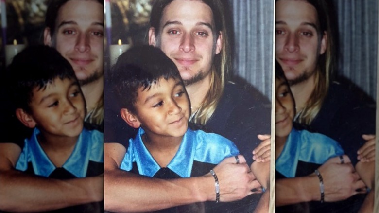 Kid Rock poses with his son as a child