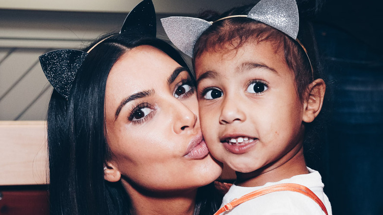 Kim Kardashian kisses North West while wearing cat ears