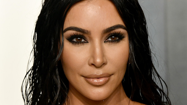 Kim Kardashian smirking