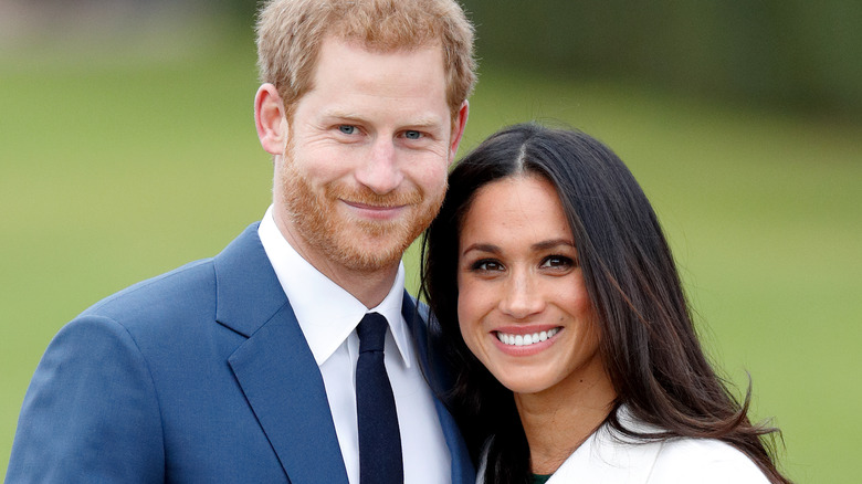 Prince Harry and Meghan Markle smiling