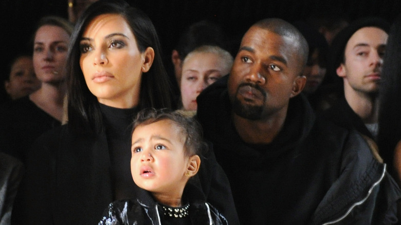 Kim Kardashian, Kanye West, and North West in 2015