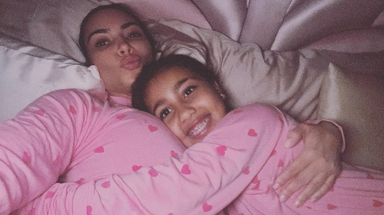 Kim Kardashian and North West smiling