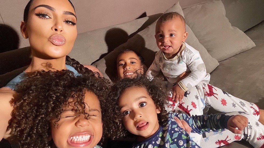 Kim Kardashian posing for a selfie with her four kids