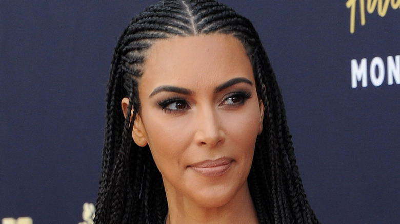 Kim Kardashian purses her lips on the red carpet